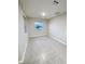 Neutral bedroom with tile floors and a bright window view at 13014 Willow Grove Dr, Riverview, FL 33579