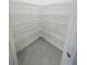 Walk-in closet with wire shelving and tile flooring at 13014 Willow Grove Dr, Riverview, FL 33579