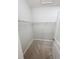 Walk-in closet with wire shelving and tile flooring at 13014 Willow Grove Dr, Riverview, FL 33579