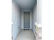 Covered entryway featuring a modern front door and stone accents, offering a welcoming appeal at 13014 Willow Grove Dr, Riverview, FL 33579