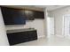Large flex space features granite countertops and dark cabinets at 13014 Willow Grove Dr, Riverview, FL 33579