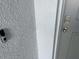 Digital deadbolt lock on a grey front door at 13014 Willow Grove Dr, Riverview, FL 33579