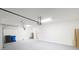 Spacious two-car garage with painted floors and walls, and garage door opener at 13014 Willow Grove Dr, Riverview, FL 33579