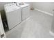 Laundry room with tile floor, washer and dryer at 13014 Willow Grove Dr, Riverview, FL 33579