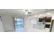 Open floor plan with kitchen, living room, and view of the lake at 13014 Willow Grove Dr, Riverview, FL 33579