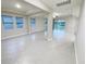 Bright living space features modern tile floors, recessed lighting, with views of the lake at 13014 Willow Grove Dr, Riverview, FL 33579