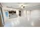 An open concept living space with stainless steel appliances and abundant natural light from sliding glass doors at 13014 Willow Grove Dr, Riverview, FL 33579