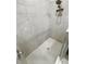 Modern walk-in shower with rainfall shower head and tiled walls at 13014 Willow Grove Dr, Riverview, FL 33579