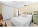 Bedroom featuring a spacious closet and light, neutral decor at 1410 Brighton Ct, Palm Harbor, FL 34684