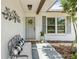 Inviting front porch with comfortable seating and decorative accents at 1410 Brighton Ct, Palm Harbor, FL 34684