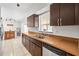 Functional kitchen with ample counter space and dark cabinets at 1410 Brighton Ct, Palm Harbor, FL 34684