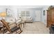 Bright living room showcasing tile floors and comfortable seating at 1410 Brighton Ct, Palm Harbor, FL 34684