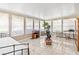 Bright sunroom with tiled floor, lots of windows and natural light at 1410 Brighton Ct, Palm Harbor, FL 34684