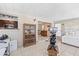 Sunroom with view of kitchen, unique furnishings and lots of natural light at 1410 Brighton Ct, Palm Harbor, FL 34684