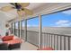 Enjoy ocean views from this inviting balcony with comfortable seating and a ceiling fan at 14900 Gulf Blvd # 308, Madeira Beach, FL 33708
