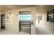 View of the elevator, unit door, and personal storage, conveniently located near the parking spot and unit access at 14900 Gulf Blvd # 308, Madeira Beach, FL 33708