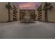 Exterior view of the building and landscaping with well manicured palm trees, great for a relaxing day at 14900 Gulf Blvd # 308, Madeira Beach, FL 33708