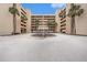 Exterior view of the building and landscaping with well manicured palm trees, great for a relaxing day at 14900 Gulf Blvd # 308, Madeira Beach, FL 33708