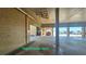 Covered garage space featuring nearby elevator access and beach views at 14900 Gulf Blvd # 308, Madeira Beach, FL 33708
