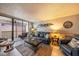 Living room with tile floors and sliding glass doors to a balcony with ocean view at 14900 Gulf Blvd # 308, Madeira Beach, FL 33708