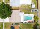 Birds eye view of the home with the backyard pool, other houses, and beautiful yard at 1512 56Th N Ave, St Petersburg, FL 33703