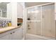 Cozy bathroom featuring granite countertops, framed mirror and glass door shower at 1512 56Th N Ave, St Petersburg, FL 33703