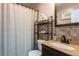 Cozy bathroom with a vanity, decorative tile, and shower with curtain at 1512 56Th N Ave, St Petersburg, FL 33703