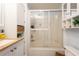 Bathroom with a shower featuring glass doors, neutral walls and storage space at 1512 56Th N Ave, St Petersburg, FL 33703