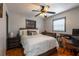 Comfortable bedroom with a wooden frame bed, ample natural light, and stylish decor at 1512 56Th N Ave, St Petersburg, FL 33703