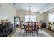 Comfortable dining room with a stylish rug, dark wood floors, and neutral paint at 1512 56Th N Ave, St Petersburg, FL 33703