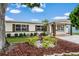 Charming single-story home featuring a well-maintained lawn and beautiful, mature landscaping at 1512 56Th N Ave, St Petersburg, FL 33703