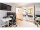 Modern home office space featuring dual monitors, bright light, and easy access to patio at 1512 56Th N Ave, St Petersburg, FL 33703