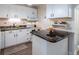 Cozy kitchen featuring white cabinets, granite countertops, and modern appliances at 1512 56Th N Ave, St Petersburg, FL 33703