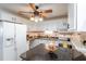 Cozy kitchen with white appliances, granite countertops, and stylish decor accents at 1512 56Th N Ave, St Petersburg, FL 33703