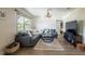 Inviting living room with a comfortable sectional sofa, stylish decor, and neutral walls at 1512 56Th N Ave, St Petersburg, FL 33703