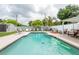Backyard pool with lounge seating, updated deck and shaded canopy at 1512 56Th N Ave, St Petersburg, FL 33703