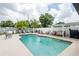 Backyard pool with lounge seating, updated deck, shaded canopy, and outdoor grill at 1512 56Th N Ave, St Petersburg, FL 33703