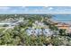 Beautiful aerial view of the neighborhood with waterfront views and blue skies, surrounded by lush greenery and vibrant city life at 1515 Bayshore Blvd # 38, Dunedin, FL 34698