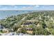An inviting overhead photograph displaying waterfront, green vegetation, condos, and nearby parking at 1515 Bayshore Blvd # 38, Dunedin, FL 34698