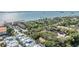 An amazing overhead shot with waterfront access, palms, verdant foliage, nearby condos, and great parking at 1515 Bayshore Blvd # 38, Dunedin, FL 34698