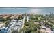 Captivating aerial shot showcasing the property's proximity to waterfront, lush trees, convenient parking, and well-maintained grounds at 1515 Bayshore Blvd # 38, Dunedin, FL 34698
