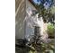 Back of house with siding, sliding glass door, and stone patio at 1515 Bayshore Blvd # 38, Dunedin, FL 34698