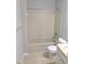 Bathroom featuring a standard tub-shower combination and a neutral vanity at 1515 Bayshore Blvd # 38, Dunedin, FL 34698