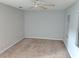 Spacious bedroom features neutral walls, carpet, and a ceiling fan at 1515 Bayshore Blvd # 38, Dunedin, FL 34698