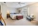 Comfortable bedroom featuring a queen-sized bed, ceiling fan and a window with natural light at 1515 Bayshore Blvd # 38, Dunedin, FL 34698