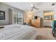 Bright bedroom featuring a king-sized bed, dresser, and ensuite bathroom at 1515 Bayshore Blvd # 38, Dunedin, FL 34698