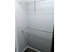 A basic empty closet with white walls, a wire shelf, and dark carpet at 1515 Bayshore Blvd # 38, Dunedin, FL 34698