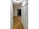 Hallway showcasing wood flooring and a closet offering ample storage space inside the townhouse at 1515 Bayshore Blvd # 38, Dunedin, FL 34698