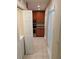 Kitchen in an alcove with stainless steel appliances, tile floor, and natural light coming through a window at 1515 Bayshore Blvd # 38, Dunedin, FL 34698