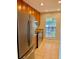 Contemporary kitchen with stainless steel appliances, granite countertops, and wooden cabinets at 1515 Bayshore Blvd # 38, Dunedin, FL 34698